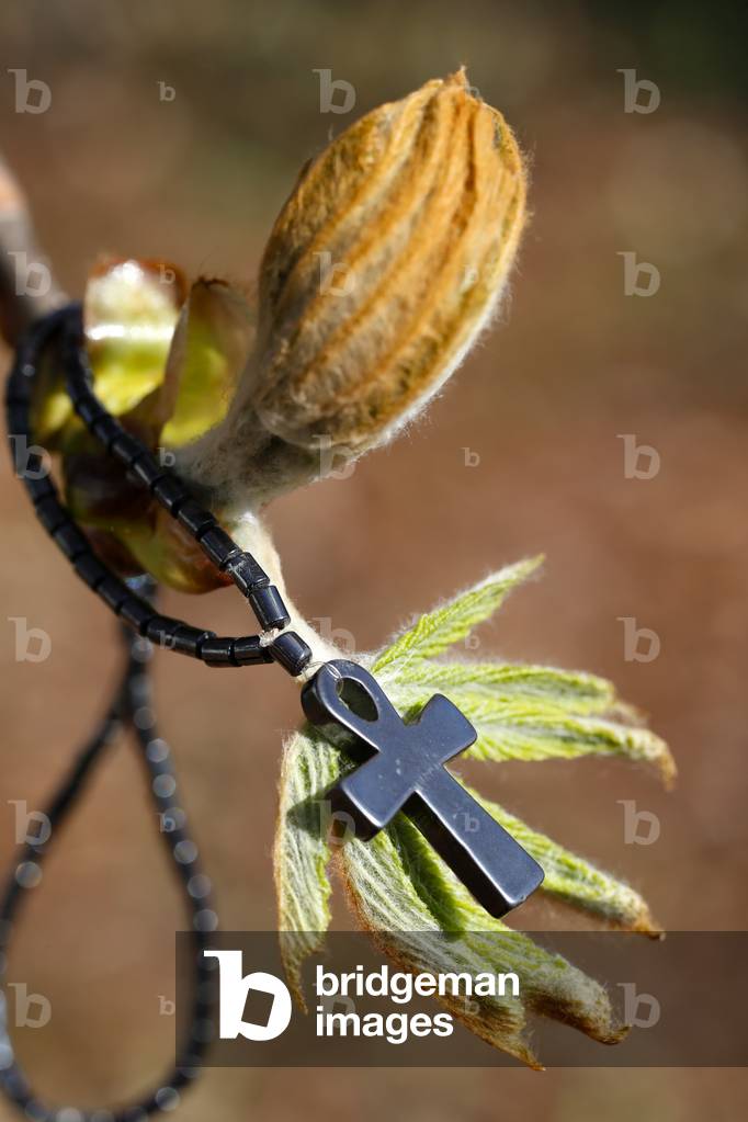 Pendant with cross and bud symbol of life that overcomes obstacles, France, 2020 (photo)