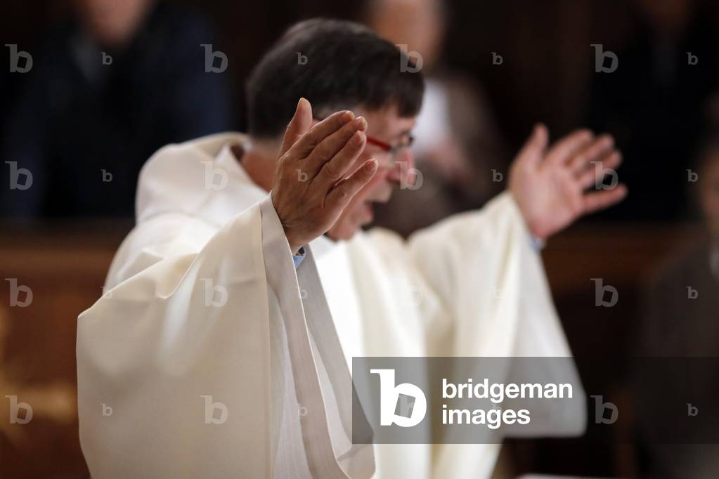 Roman catholic mass.  Eucharist celebration. Saint-Nicolas de Veroce church. France. (photo)