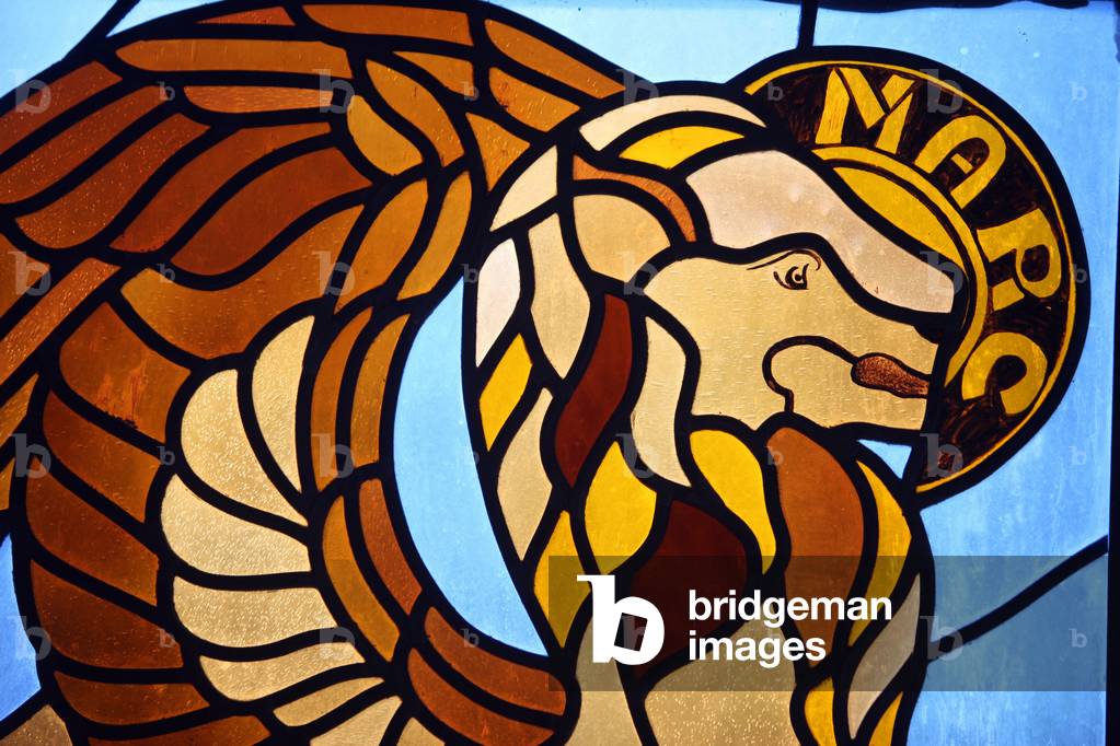 Stained glass depicting evangelist Saint-Mark symbolised by a lion. Servoz France