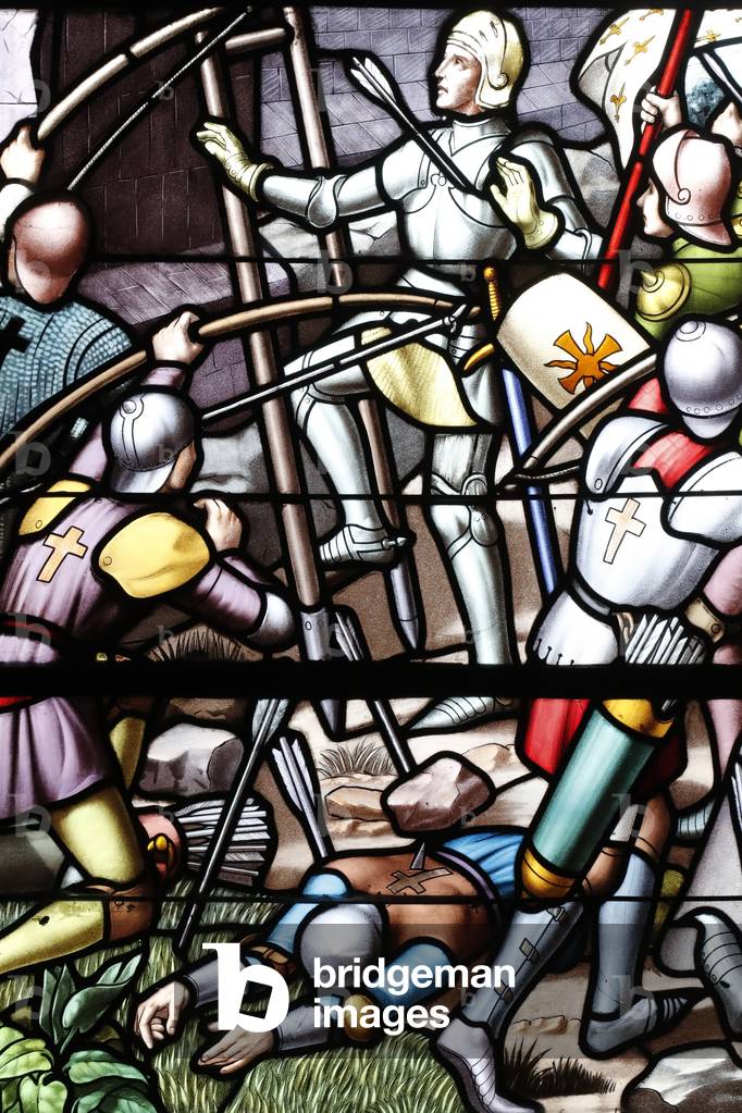 Saint Thomas of Cantorbery church.  Stained glass window.  Joan of Arc. Militatry campaigns.  Cuiseaux. France.
