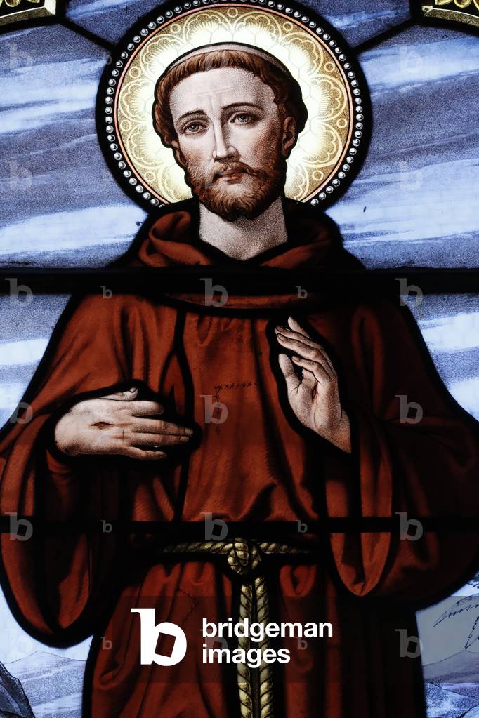 Saint Cyr and Sainte Julitte church.  Stained glass window.  Saint Francis of Assisi, also known in his ministry as Francesco. Beaufort. France.