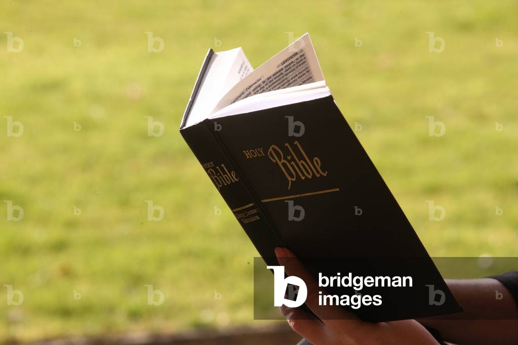 Woman reading the bible. Marmagne France