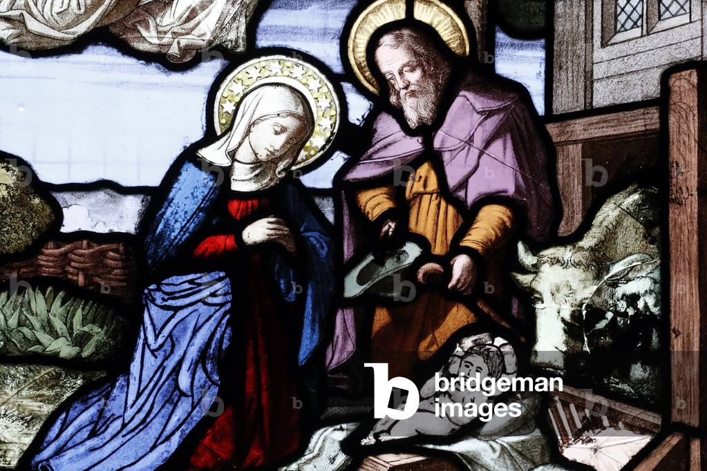 Cordeliers church.  Stained glass window.  Nativity of Jesus or birth of Christ. The nativity is the basis for the Christian holiday of Christmas on December 25.  Lons le Saunier. France.