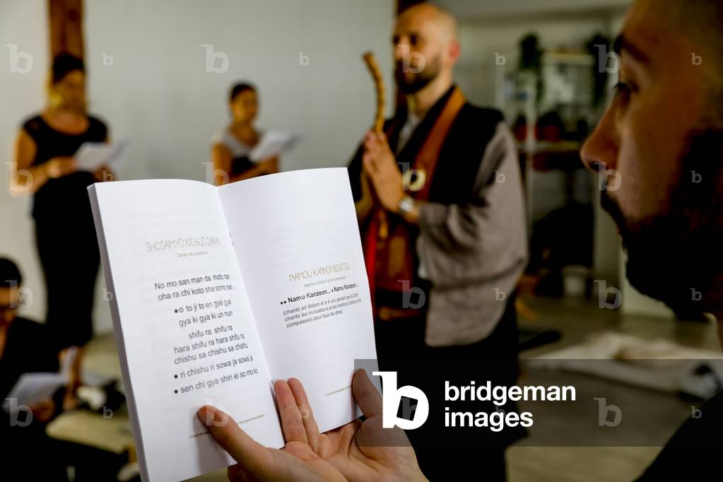 Zen sesshin (retreat) in Paris, France. Chanting before a meal. (photo)