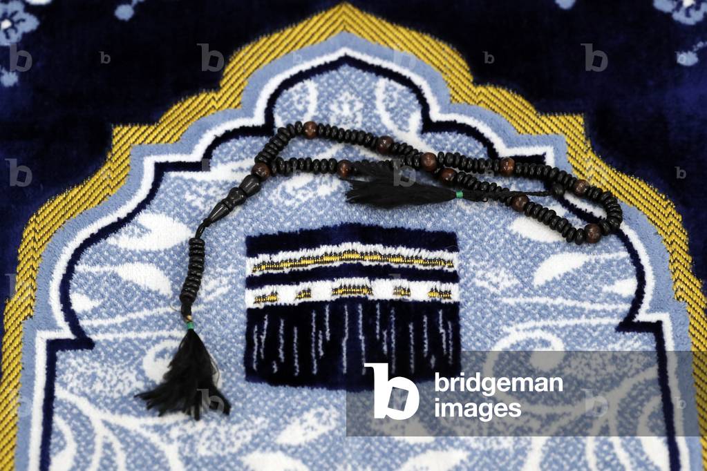 Islamic prayer rug and prayer beads in a mosque, The Kaaba, 2019 (photo)