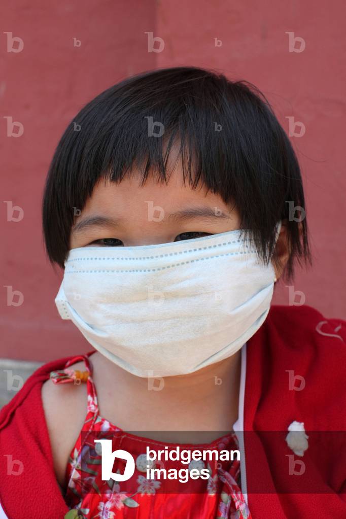 Vietnamese girl with a mask, Ho Chi Minh City, Vietnam