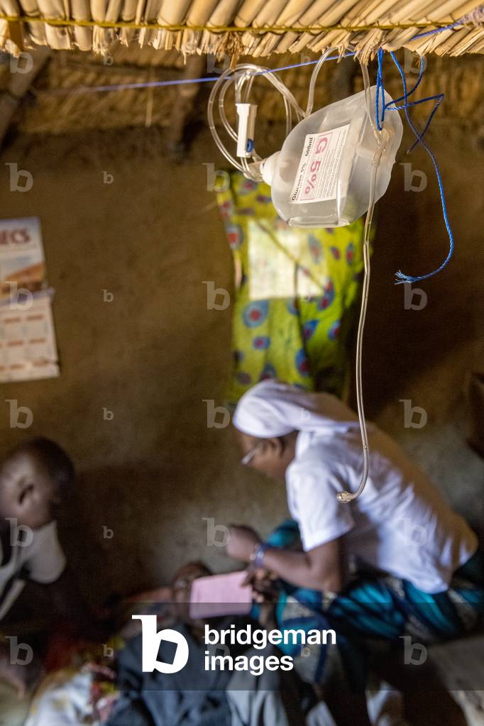 Drip used for treating Jean, a 42-year-old man dying of AIDS in his home place. Vivre dans l'Esperance (living with hope) NGO. Village near Dapaong, Togo.