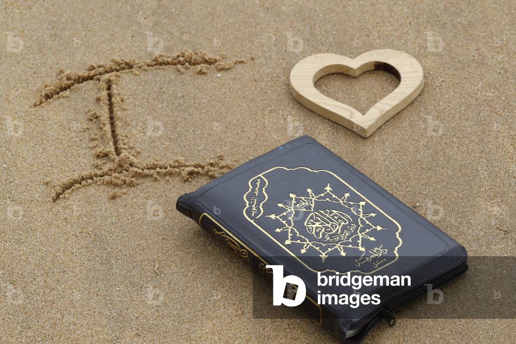 Open Quran on the sand with heart, I Love Quran, France (photo)