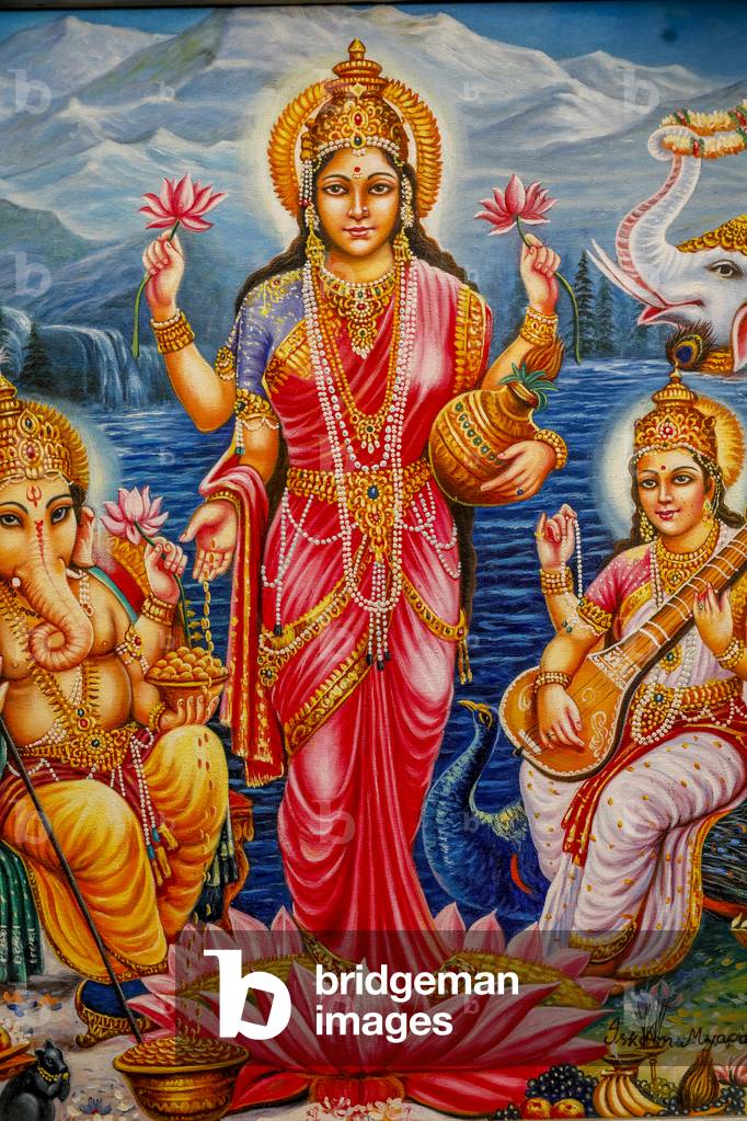 Hindu goddess Lakshmi surrounded by Ganesh and Saraswati, Bhaktivedanta manor, Watford, U,K,  2018 (photo)