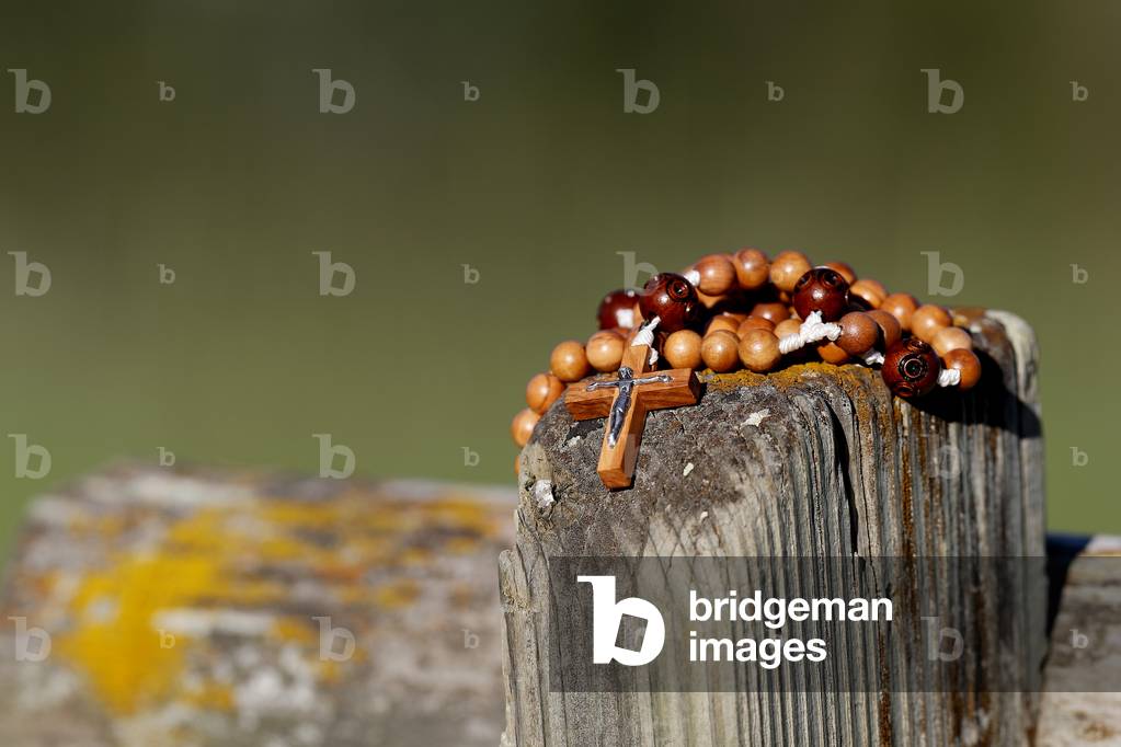 Rosary in nature on a bench.  Combloux. France.