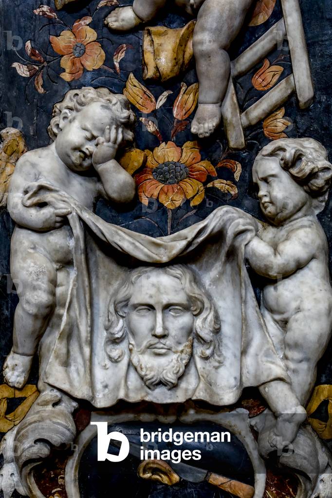 Baroque reliefs in SS. Salvatore (Saviour) church, Palermo, Sicily, Italy. Angels holding the veil of Veronica (photo)