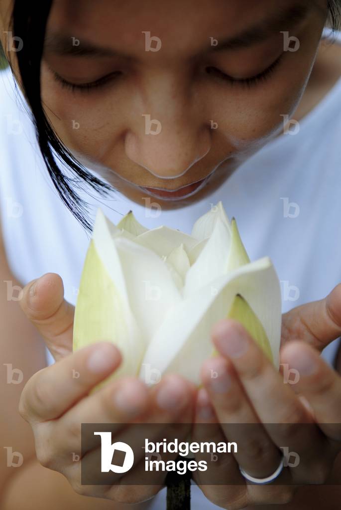 Woman with lotus flower, Hanoi, Vietnam