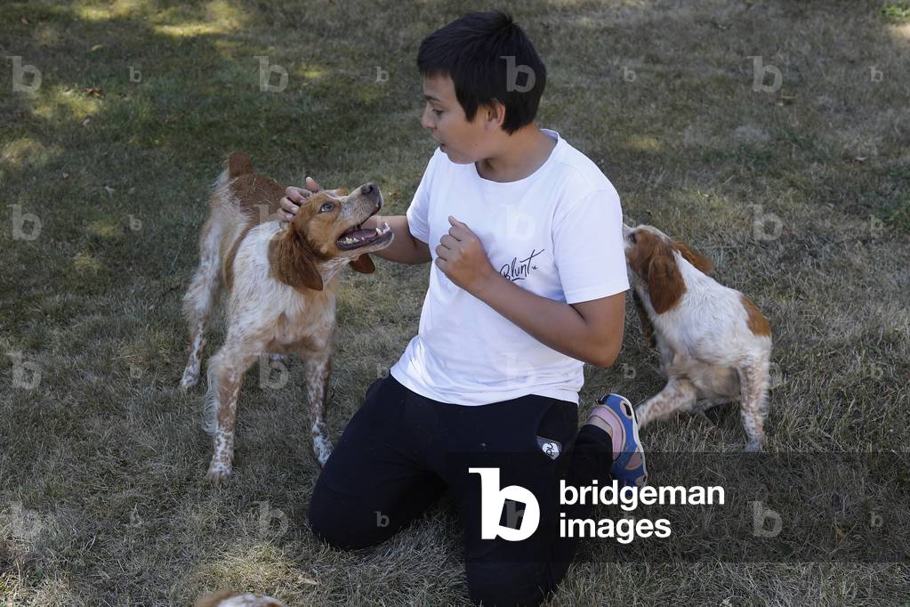 Boy with dogs. Eure, France.