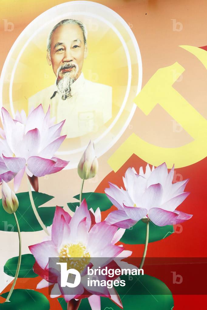 Communist government propaganda poster in the street, Cai Be, Vietnam (photo)