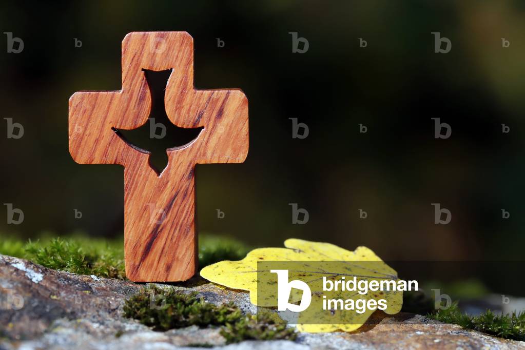 Wooden christian coss with Holy Spirit with autumn leaf.  France.