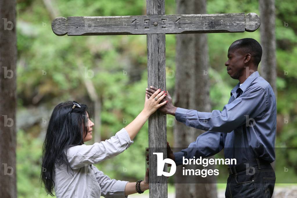 Man and woman praying in the mountain. Les Contamines France