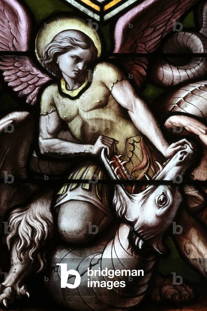 Geneva, Geneva, Switzerland, le 5/7/2015 - Basilica Notre-Dame of Geneva. Stained glass window. Angel fighting Satan as a dragon.