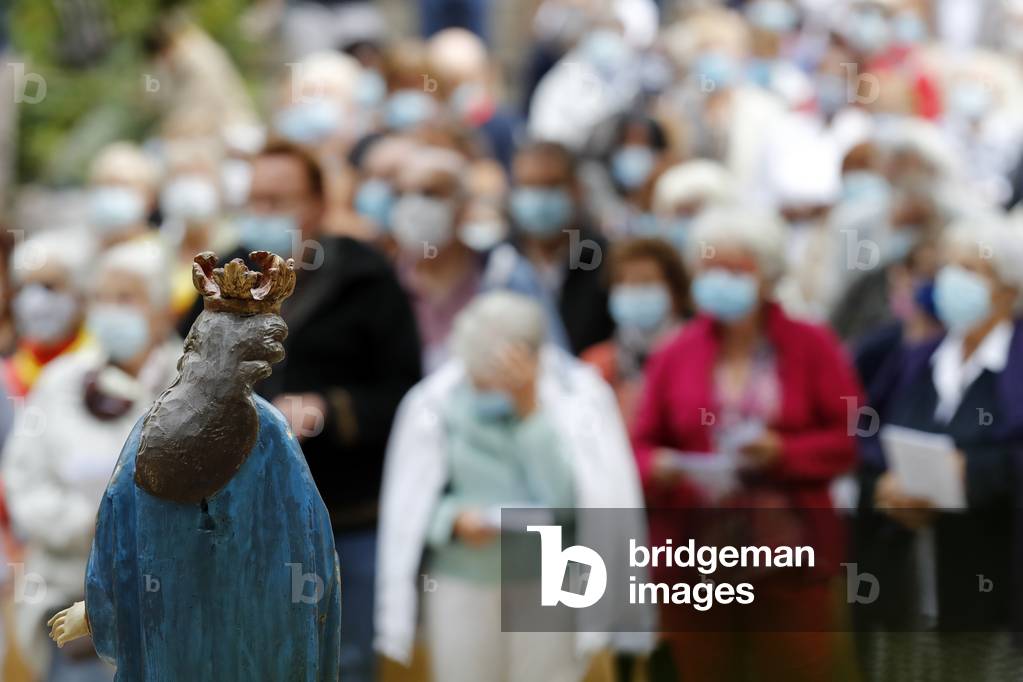 Catholic church during covid-19 epidemic. Celebration of the mass.  Sanctuary of La Benite Fontaine. France.