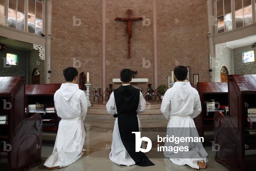 Cistercian Abbey, Our Lady of My Ca, Monks praying in the church, Vietnam, 2019 (photo)