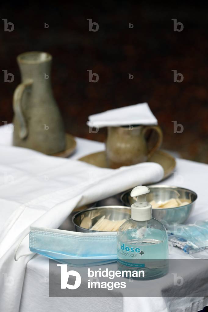 Catholic church during covid-19 epidemic. Sunday mass. Eucharistic table.  Sanctuary of La Benite Fontaine. France.