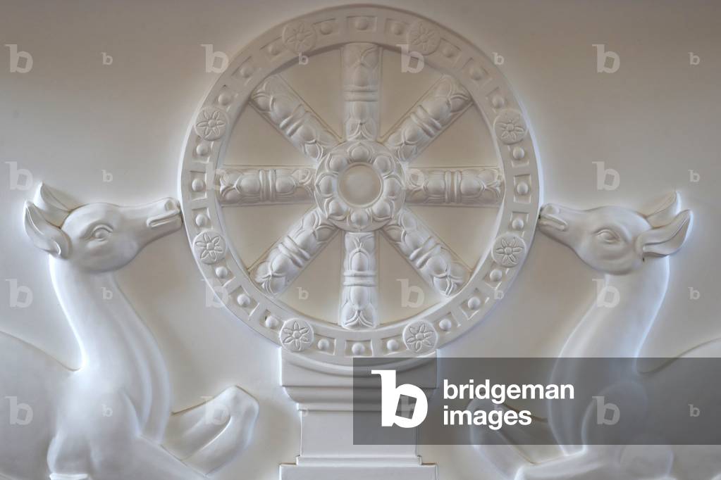 Two deers flanking a Dharma wheel, Buddhist symbols, Hue, Vietnam, 2019 (photo)
