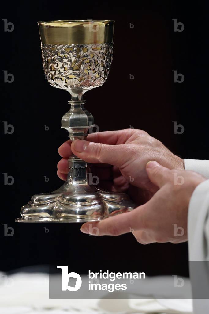 Catholic church during covid-19 epidemic. Sunday mass.  Priest at eucharistic celebration.  Sallanches.  France.