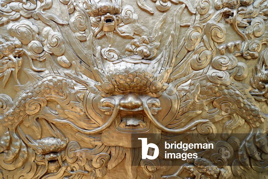 Chinese Relief Sculpture, Golden dragon, The dragon is a symbol of power, strength, and good luck,  Hue, Vietnam, 2019 (photo)