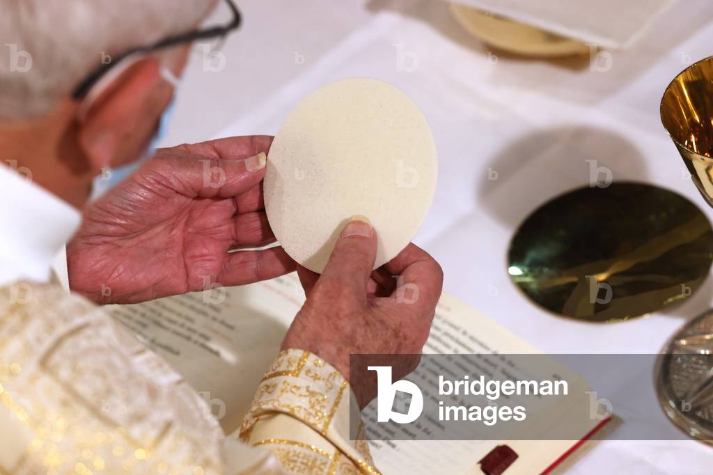 Catholic church during covid-19 epidemic. Sunday mass. Eucharistic celebration.  Sanctuary of La Benite Fontaine. France.