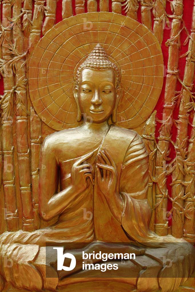 Detail of Buddha sculpture in Wat Ounalom : Buddha teaching to his disciples in Veluvana bamboo forest Phnom Penh Cambodge