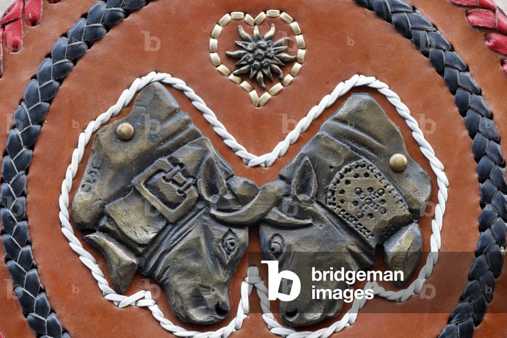 Sant Orso fair, Artists and craftsmen from Valle d’Aosta proudly display their works, Cow bell, detail, Aosta, Italy (photo)