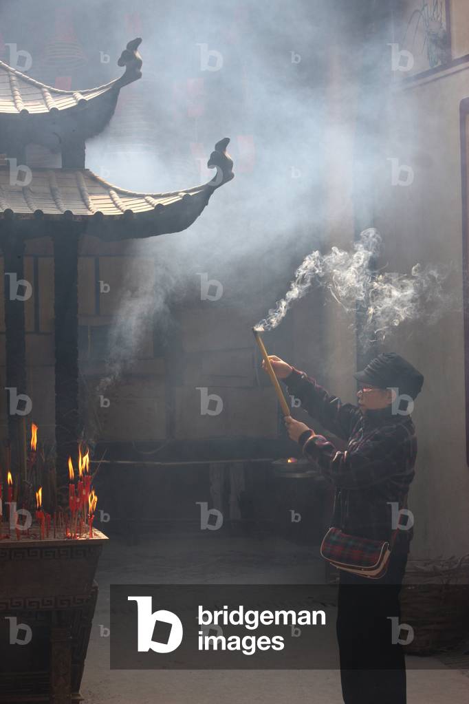 Kun Iam Temple. Worshipper Macau China