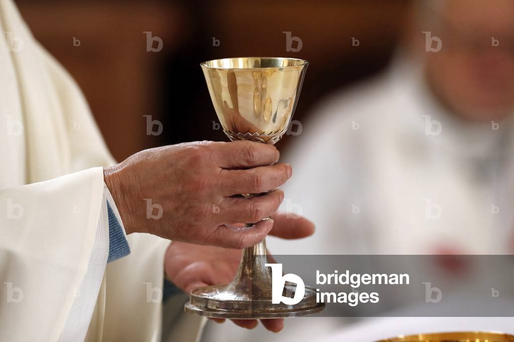 Roman catholic mass.  Eucharist celebration. Saint-Nicolas de Veroce church. France. (photo)