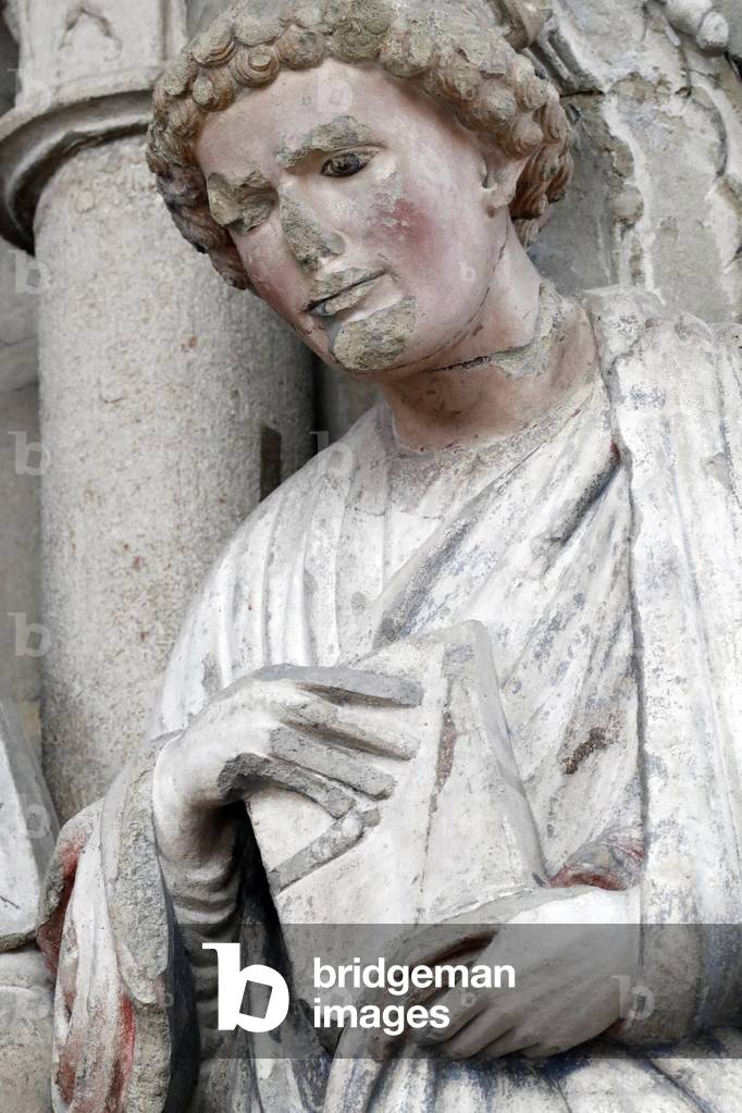 Saint Jogn, the evangelist.  Painted portal.  Cathedral of Notre Dame of Lausanne.  Switzerland.