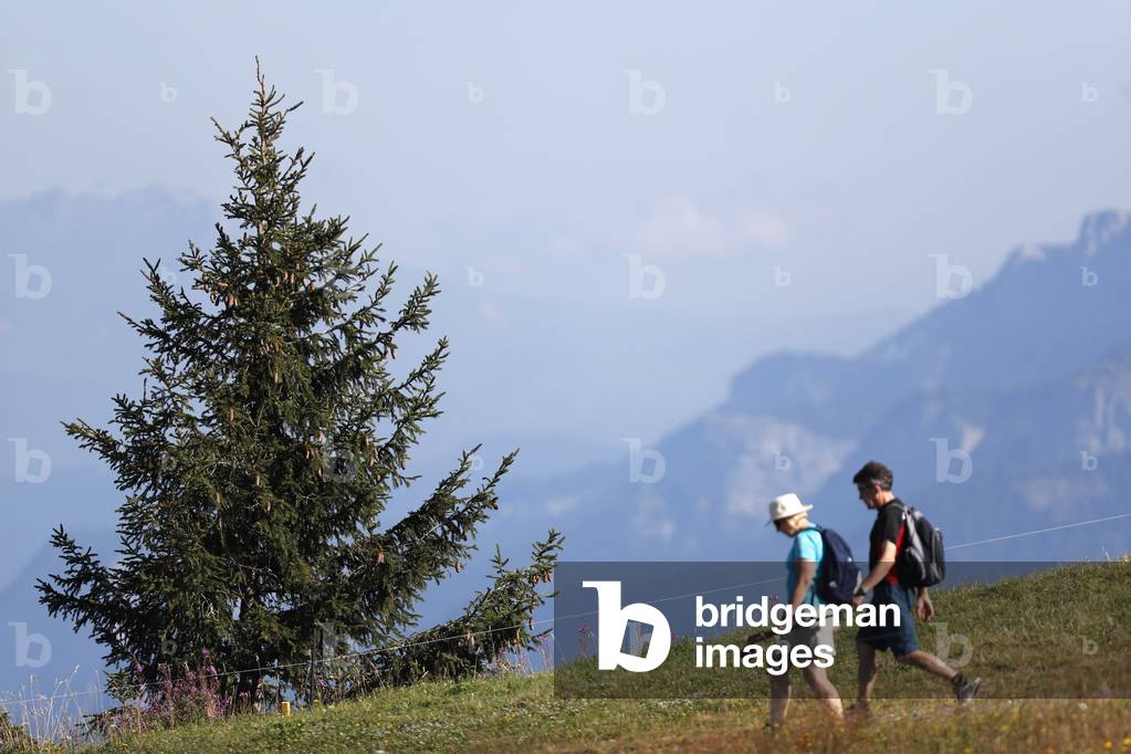 French Alps, Mont Blanc Massif, Walkers on a path in summer, Saint-Gervais, France, 2019 (photo)