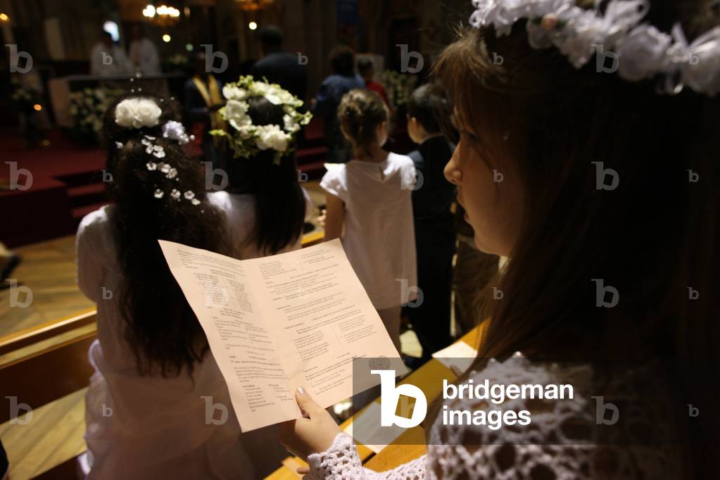 First communion celebration in a catholic church Paris France