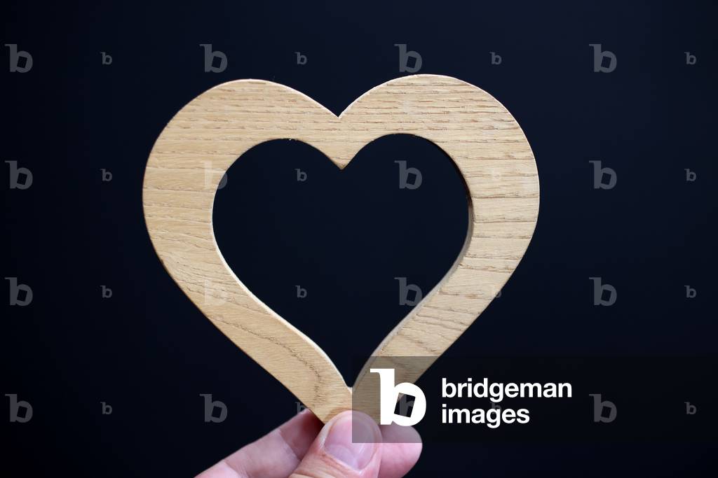 Wooden heart in hand. France.