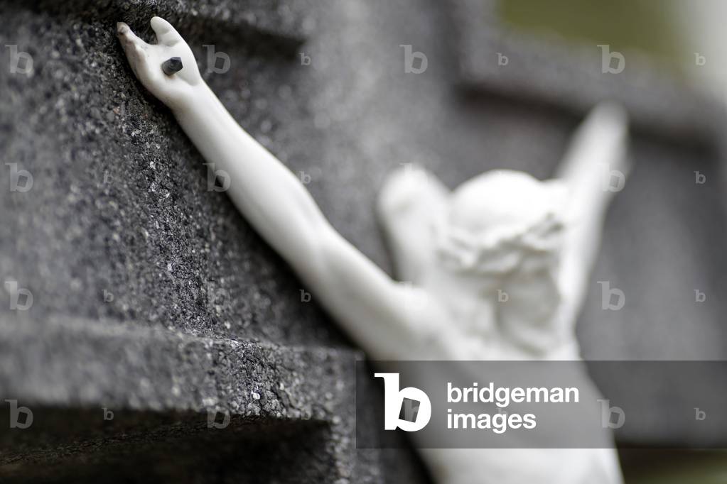 Grave in cemetery.  Crucifix. Jesus on the cross.  Annecy. France.