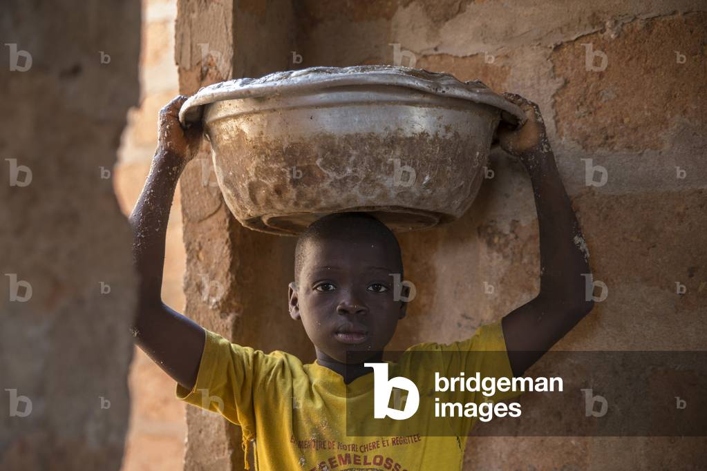 Child worker in a farm in Bohicon, Benin, Africa (photo)