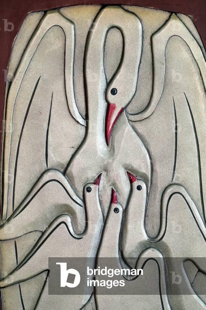 Mother pelican feeding her little baby pelicans symbolise the Passion of Jesus and the Eucharist, Thi Nghe Church, Ho Chi Minh City, Vietnam, 2019 (photo)