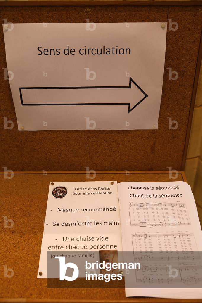 Pentecost mass in St Nicolas's church, Beaumont-le-Roger, France. COVID-19 instructions