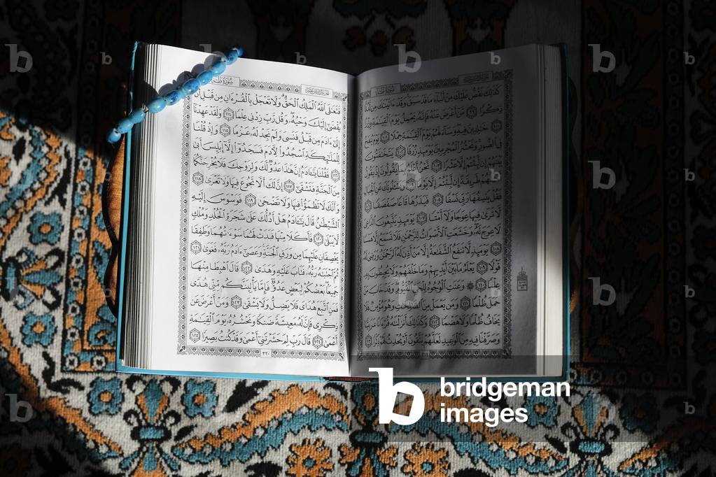 Kuran on a prayer mat