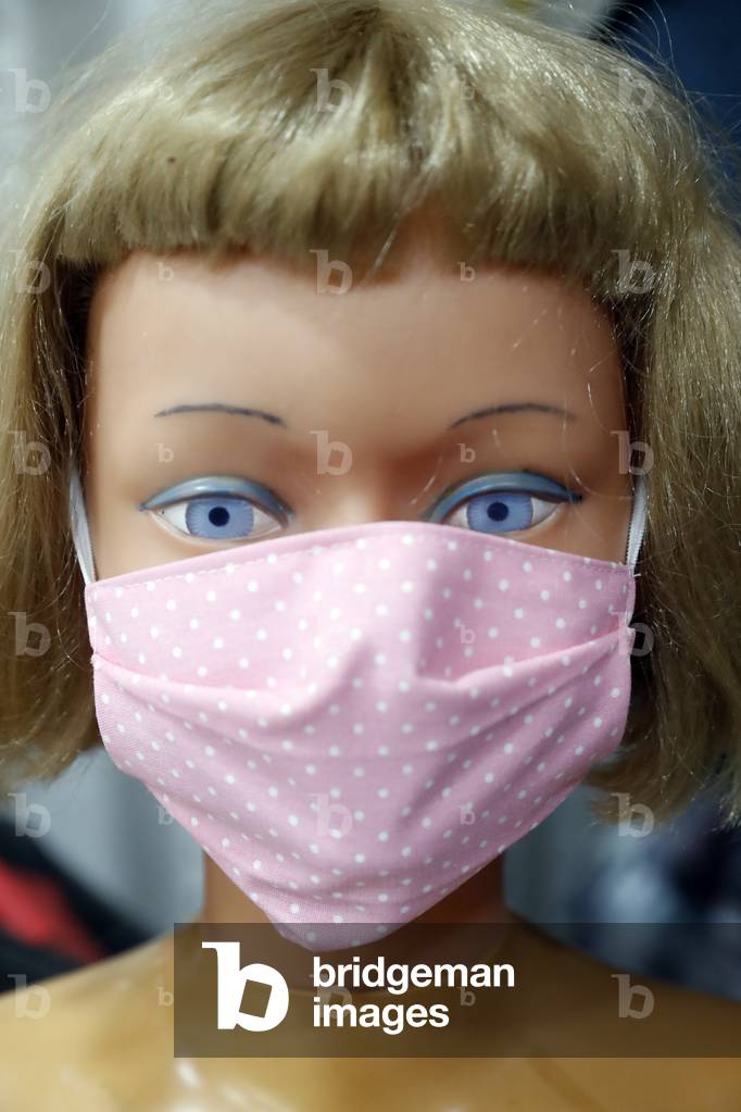 Doll with a surgical mask. Covid-19. France.