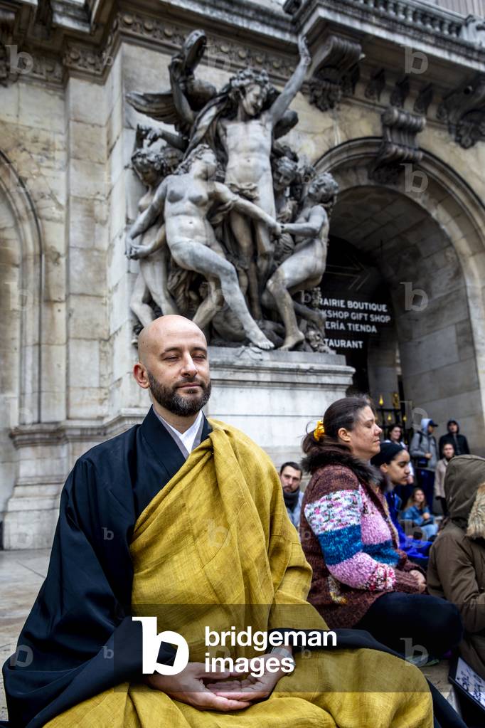 Zen meditation at the start of a climate march in Paris, France, 2019 (photo)