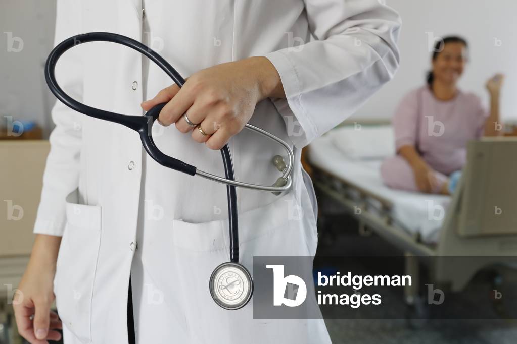 Hospital doctor with stethoscope, Cardiology, Ho Chi Minh City, Vietnam, 2019 (photo)