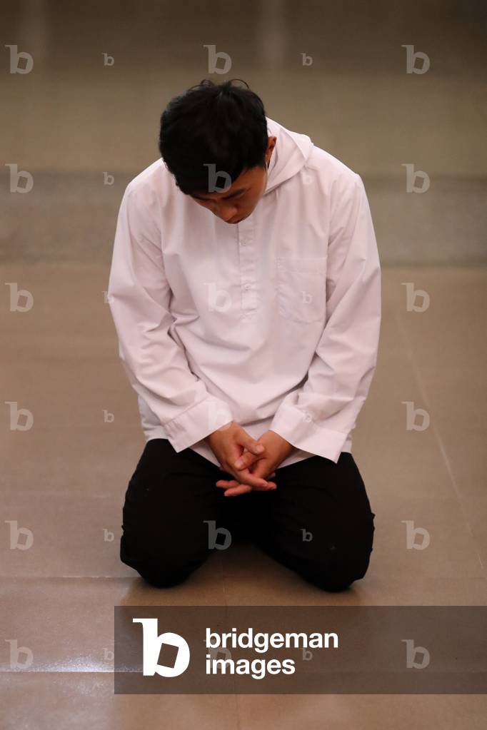 Cistercian Abbey, Our Lady of My Ca, Monk praying in the church, Vietnam, 2019 (photo)