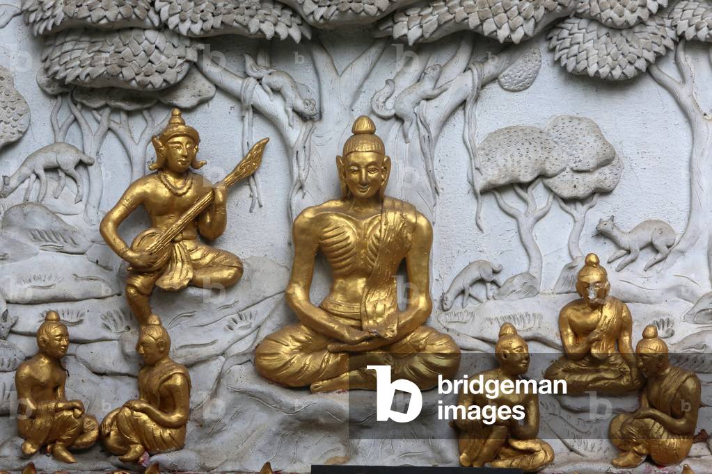 Relief depicting a scene of the Buddha's life in Wat Chai Mongkhon, Chiang Mai. Buddha as an ascetic. Thailand (photo)