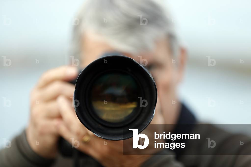 Photographer taking a picture, Norway (photo)