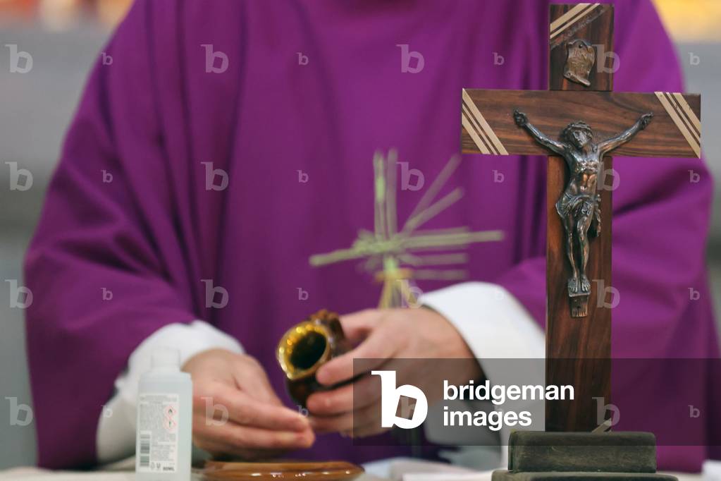 Catholic church during covid-19 epidemic. Sunday mass.  Priest at eucharistic celebration.  Saint Joseph church.  France.