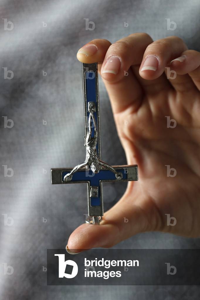 Inverted crucifix is an anti-Christian symbol, Ho Chi Minh City, Vietnam, 2019 (photo)