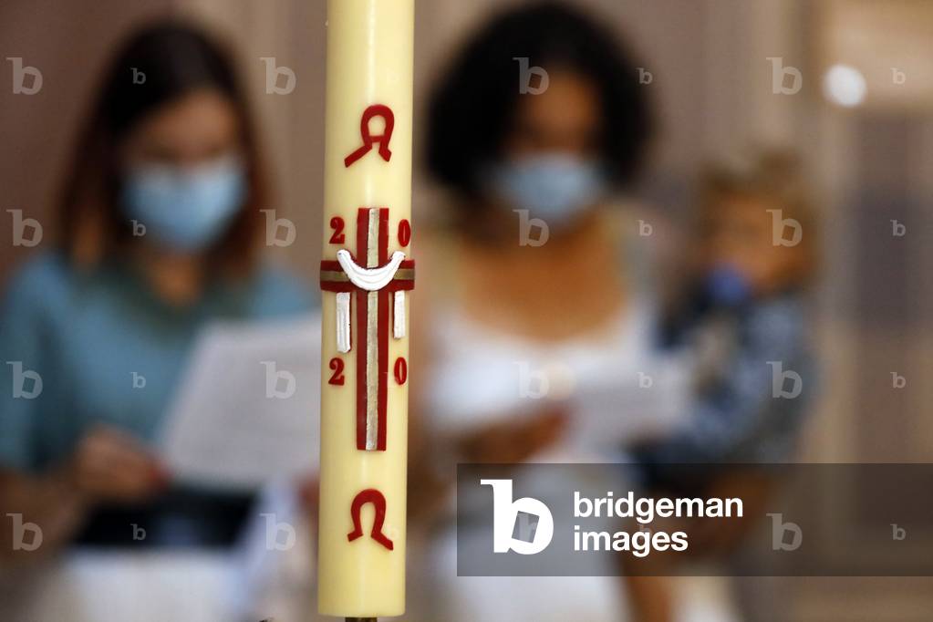 Catholic church. Baptismal liturgy.  Easter candle.  France.